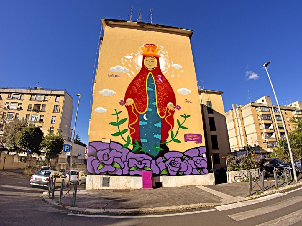 “OGNI SENO HA UNA STORIA, LO SCREENING TE LA PUÒ RACCONTARE”, LA REGIONE LAZIO ADERISCE ALLA CAMPAGNA DI SENSIBILIZZAZIONE: A ROMA UN MURALE RAFFIGURANTE SANT’AGATA